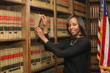 Women in workplace, woman in law, African American lawyer in law library
