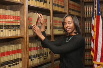 Wall Mural - Women in workplace, woman in law, African American lawyer in law library
