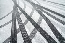 Tire track on the street after snow