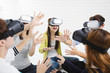 © Tom Wang - Young group having fun with new technology vr headset