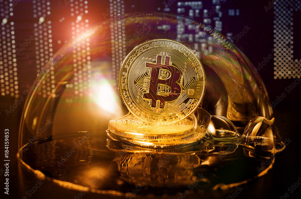 Bitcoin. Bitcoin in a soap bubble on video card background.