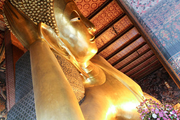 detail of reclining buddha gold statue  in wat Pho, bangkok, Thailand