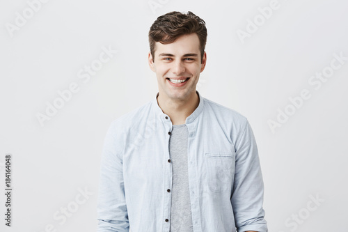 Handsome Attractive Young Man Dressed In Light Blue Shirt Over T