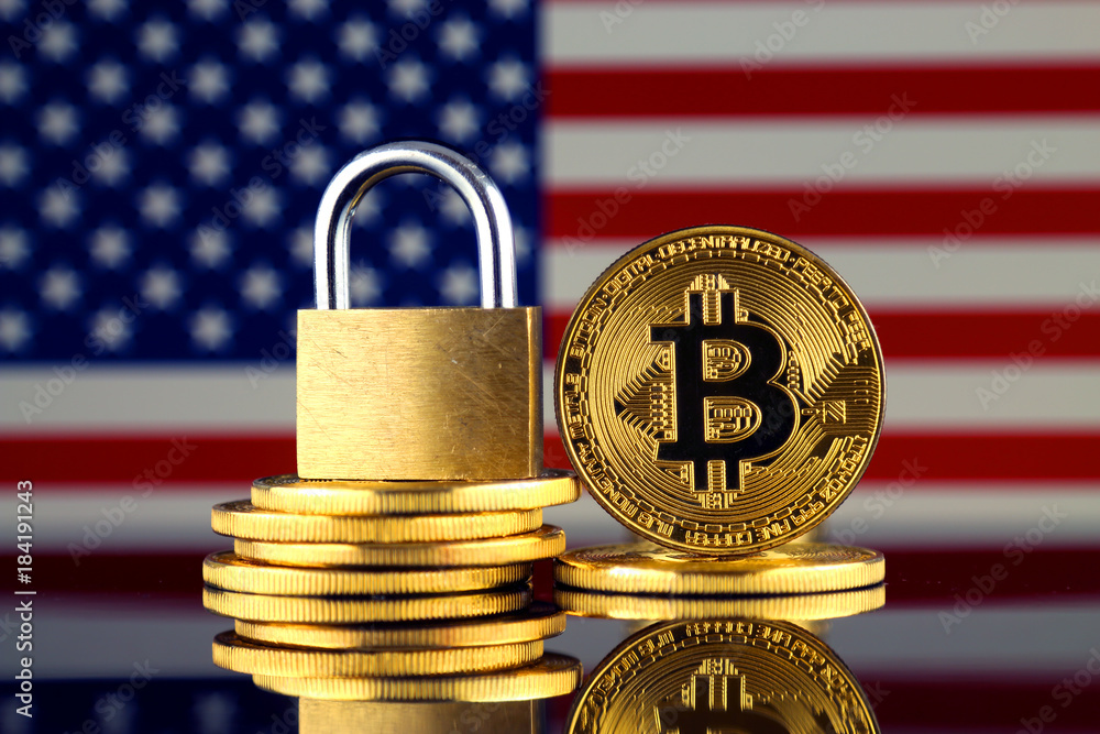 Physical version of Bitcoin, golden padlock and United States Flag. Prohibition of cryptocurrencies, regulations, restrictions or security, protection, privacy.