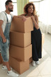 © ASDF - couple standing next to boxes when moving to a new house