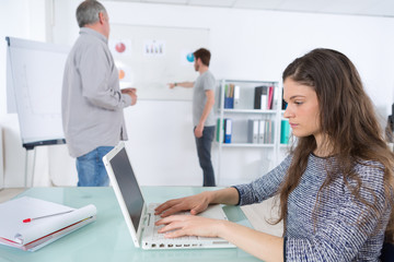 attractive girl university student using laptop in classroom