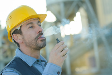 worker smoking electronic cigarette