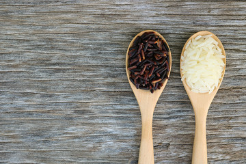 Wall Mural - Riceberry and Jasmine rice in wooden spoon.