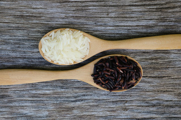 Wall Mural - Riceberry and Jasmine rice in wooden spoon.