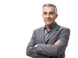 © stokkete - Confident businessman posing with arms crossed