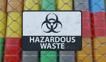 hazardous waste sign on chain link fence. oil barrels in background. 3d rendered illustration.