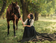 © kharchenkoirina - Gourmet lady in a vintage dress. Beautiful girl laughs looking at her horse. Artistic Photography