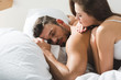© LIGHTFIELD STUDIOS - young woman lying on her sleeping boyfriend in morning