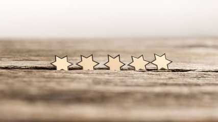 Wall Mural - five stars in a row on a rustic wooden boards