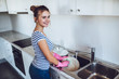 Young woman is doing cleaning at home