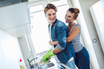 Wall Mural - Couple is doing cleaning at home