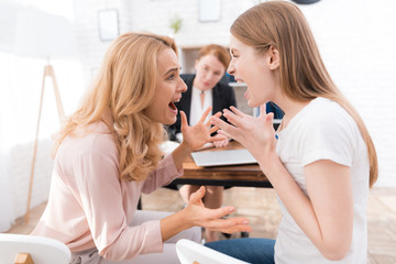 Wall Mural - Mom and daughter-teenager at a reception with a psychologist.