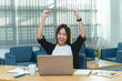 © reewungjunerr - Beautiful asian businesswoman working at the office  in the evening,Thailand worker happy after looking laptop,Success from work