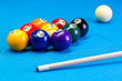 Billiard pool game nine ball setup with cue on billiard table