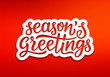 Seasons greetings text on white paper label with carving over red background. Modern calligraphy lettering on sticker for season greetings. Vector background