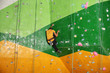 © Africa Studio - Young man exercising in climbing gym