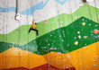© Africa Studio - Young man exercising in climbing gym