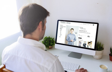 Wall Mural - man shopping online on computer