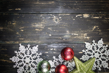 Wall Mural - Christmas Holiday Ornaments on a Dark Wood Background.