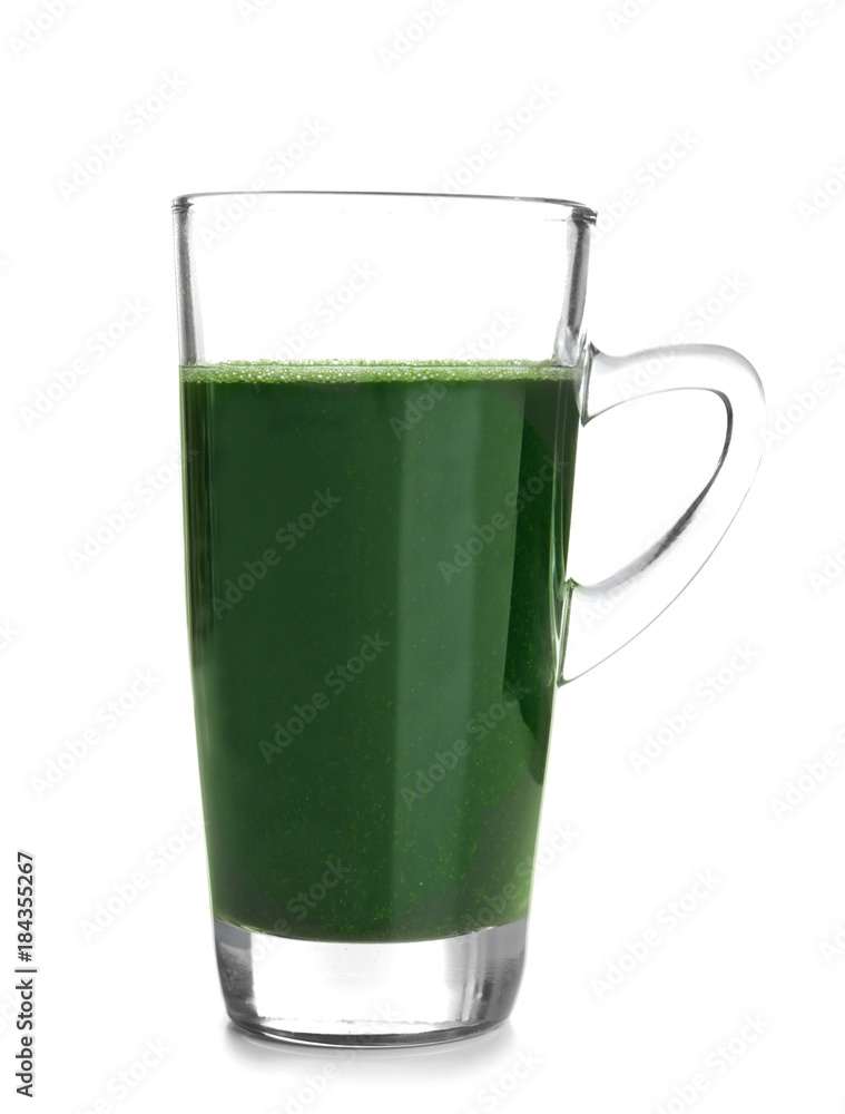 Glass cup of wheat grass juice on white background