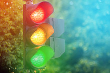 Triple Red Yellow Green Light Of Traffic Lights In Summer City Control Lamp Concept