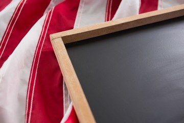 Wall Mural - American flag and slate on wooden table