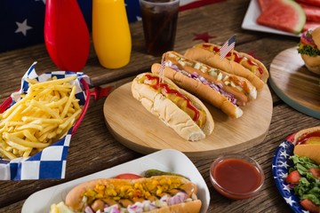 Wall Mural - Hot dogs on wooden table with 4th july theme