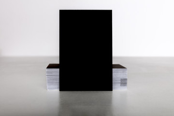 Wall Mural - Black business card mockup on a light background