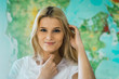 © Kike Arnaiz/ADDICTIVE STOCK - Cheerful woman looking at camera