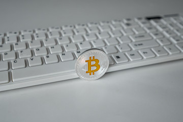 Sticker - Virtual currency Bit coins on the keyboard background. Crypto currency BTC