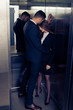 Sensual business couple in elevator