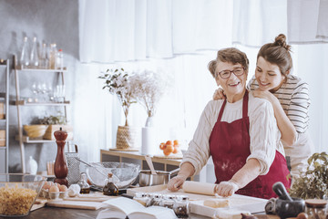 Senior woman in kitchen apron