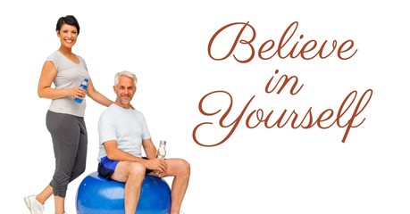 Wall Mural - Believe in yourself text and fit old couple with exercise ball