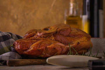 Big piece of smoked pork meat on cutting board