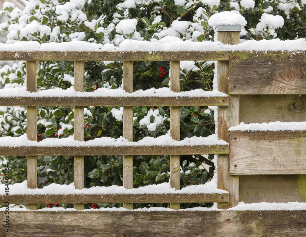 Wood fence covered in snow Stock Photo | Adobe Stock