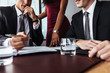 © Jacob Lund - Businessman noting important points during meeting