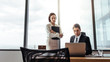 © Jacob Lund - Businessman working on laptop with secretary