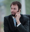 © ASDF - Mature smiling confident business man talking on the phone