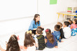 © AntonioDiaz - Preschoolers sitting in the classroom floor