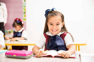 Beautiful girl enjoying school with a smile