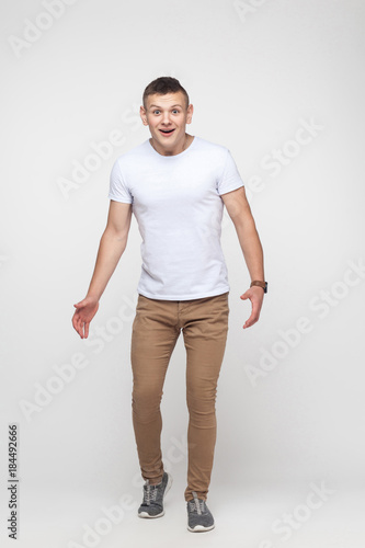 Young man with shocked face looking at camera