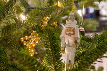 White Nutcracker Christmas Ornament On Tree