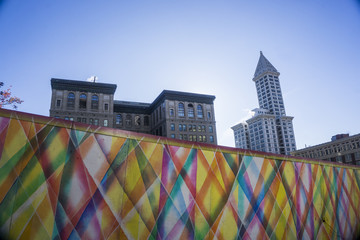 Downtown urban views with a colorful wall and skyscapers