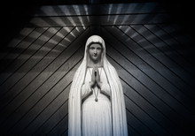 Virgin Mary Statue. Holy Woman Sculpture In Roman Catholic Church. Our Lady Image. Black & White
