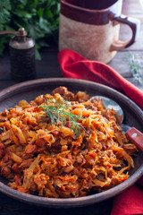 Wall Mural - Traditional Polish bigos made from fresh and sour cabbage, selective focus